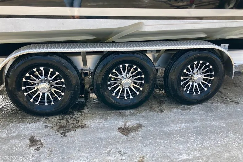 Slide: The Image of Triple-axle trailer with sleek wheels for 2005 Donzi 35 ZF Daytona boat. - 56
