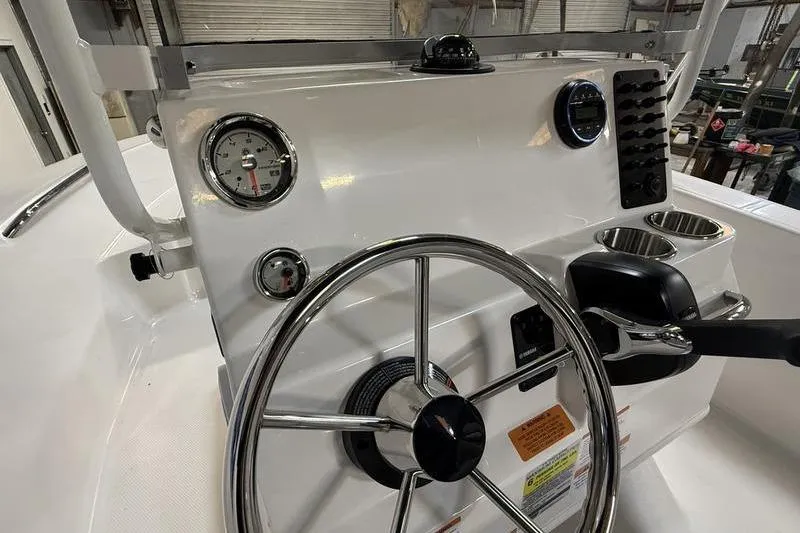 Slide: The Image of Steering console of the 2026 Robalo R160 Center Console. - 12