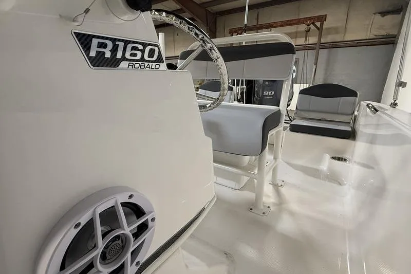 Slide: The Image of Interior view of the 2026 Robalo R160 Center Console boat. - 14