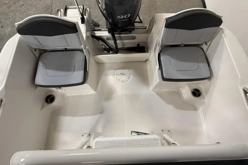 Slide: The Image of Interior view of 2026 Robalo R160 Center Console with two seats. - 8