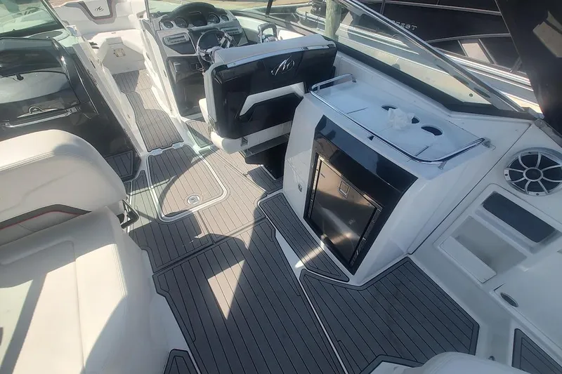 Slide: The Image of 2017 Monterey 298SS Super Sport boat interior with sleek seating and modern dashboard. - 16