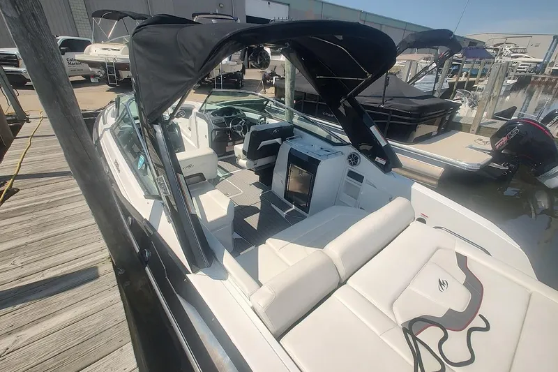 Slide: The Image of 2017 Monterey 298SS Super Sport boat docked with canopy. - 18