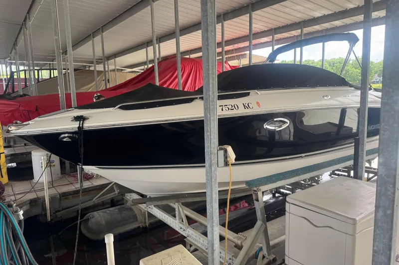 The Image of 2005 Monterey 248LS Montura Bowrider docked in covered marina. - 1