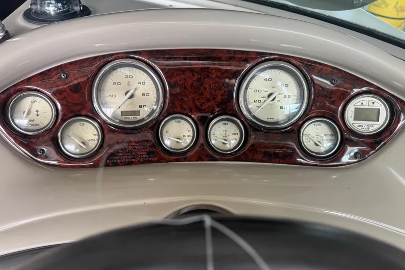 Slide: The Image of Dashboard of a 2005 Monterey 248LS Montura Bowrider with gauges and controls. - 16