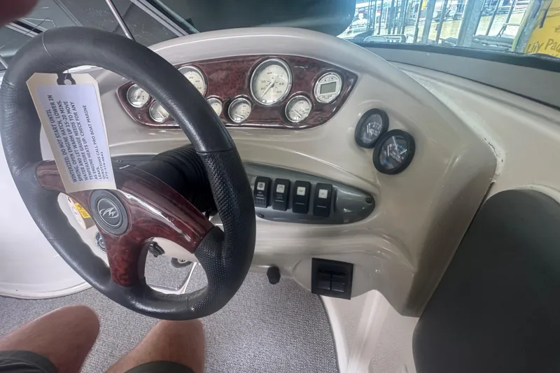 Slide: The Image of Steering wheel and dashboard of 2005 Monterey 248LS Montura Bowrider boat. - 17