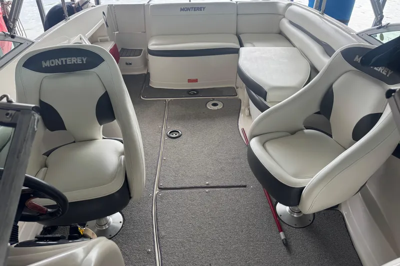 Slide: The Image of 2005 Monterey 248LS Montura Bowrider interior with seating and steering wheel. - 22