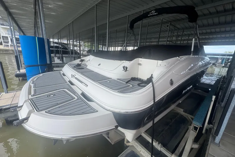Slide: The Image of 2005 Monterey 248LS Montura Bowrider docked in covered marina. - 4
