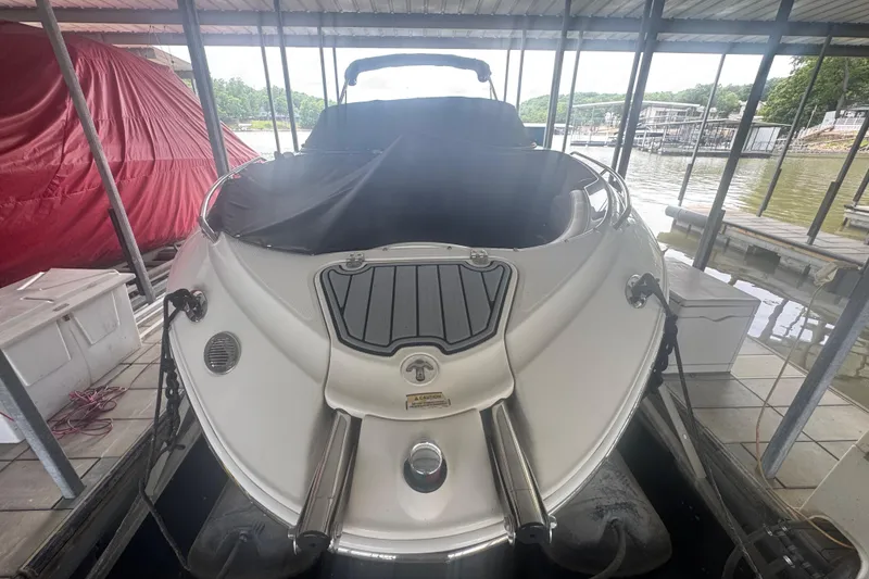 Slide: The Image of 2005 Monterey 248LS Montura Bowrider docked in a covered marina. - 5
