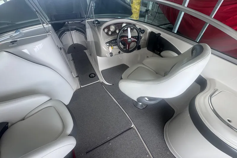 Slide: The Image of 2005 Monterey 248LS Montura Bowrider interior with steering wheel and seating. - 7