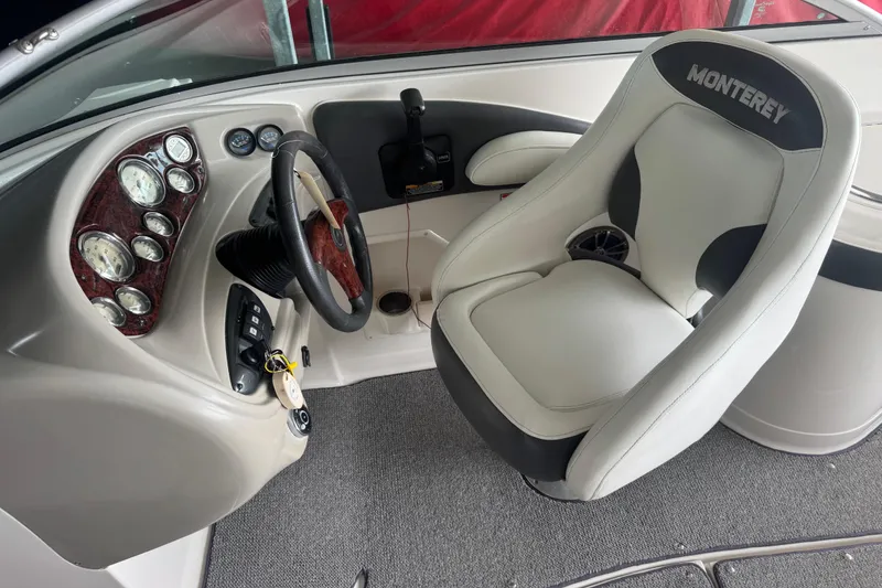 Slide: The Image of 2005 Monterey 248LS Montura Bowrider cockpit with steering wheel and gauges. - 9