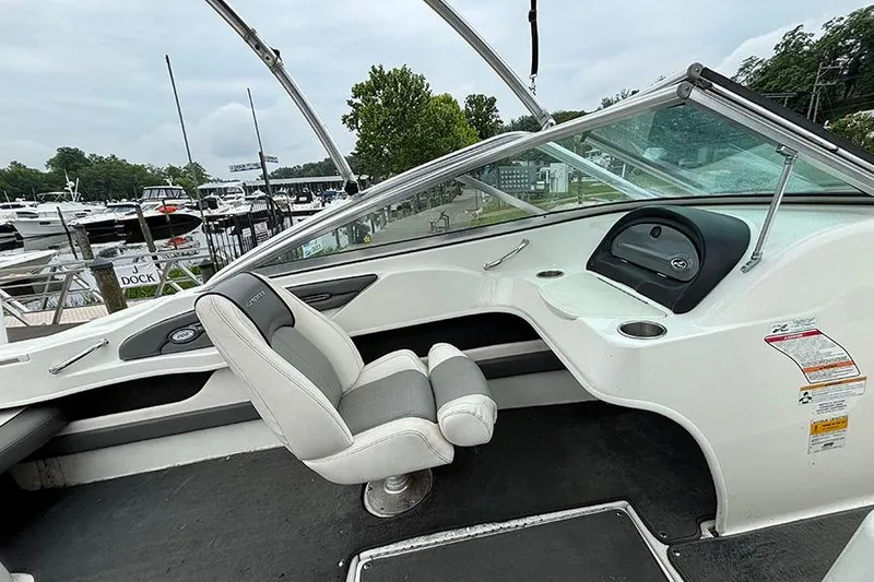 Slide: The Image of Interior of a 2011 Sea Ray 205 Sport boat at a marina dock. - 15