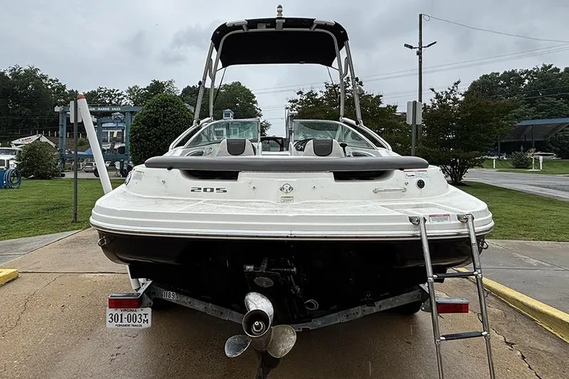 Slide: The Image of 2011 Sea Ray 205 Sport boat on trailer, rear view, overcast day. - 6