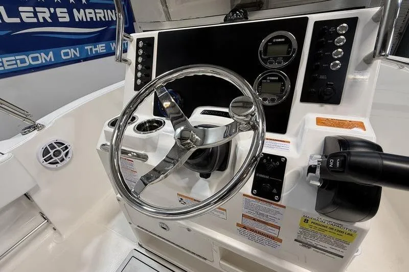 Slide: The Image of Robalo R180 Center Console 2026 steering console with instruments. - 10