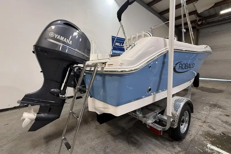 Slide: The Image of 2026 Robalo R180 Center Console boat with Yamaha outboard motor. - 2
