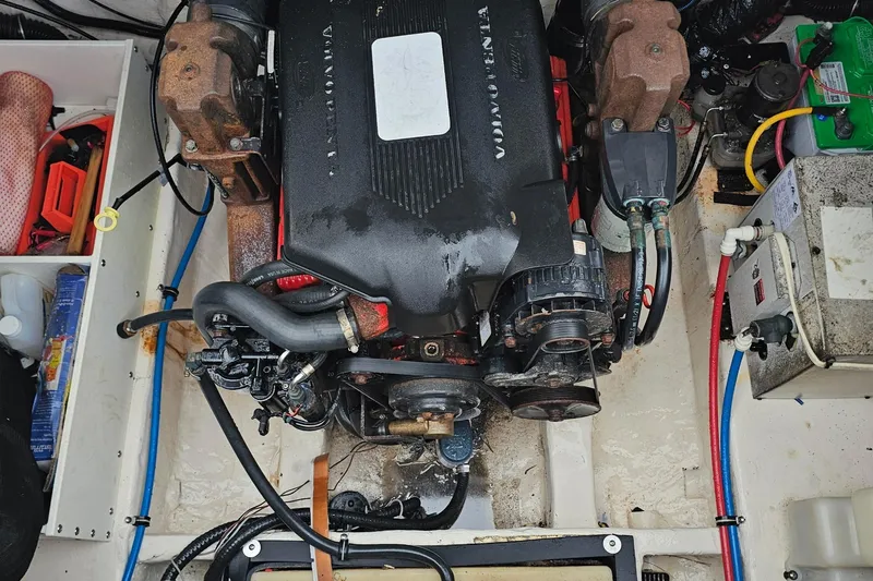 Slide: The Image of Engine compartment of a 2002 Wellcraft 2600 Martinique boat, featuring a Volvo Penta engine. - 22