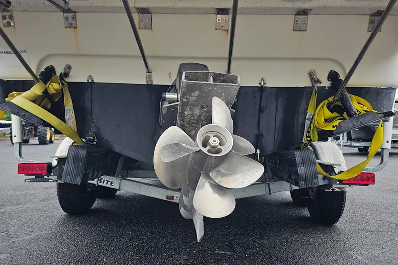 Slide: The Image of Rear view of a 2002 Wellcraft 2600 Martinique boat on a trailer, showing the propeller. - 5