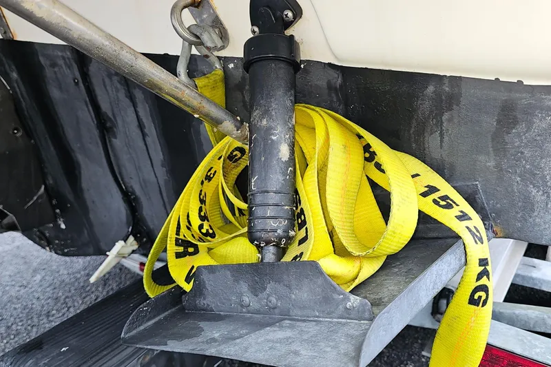 Slide: The Image of Yellow tow strap on Wellcraft 2600 Martinique boat, 2002 model, secured to trailer. - 8