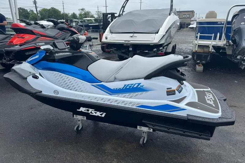 Slide: The Image of 2026 Kawasaki STX160X Jetski parked on a lot. - 6