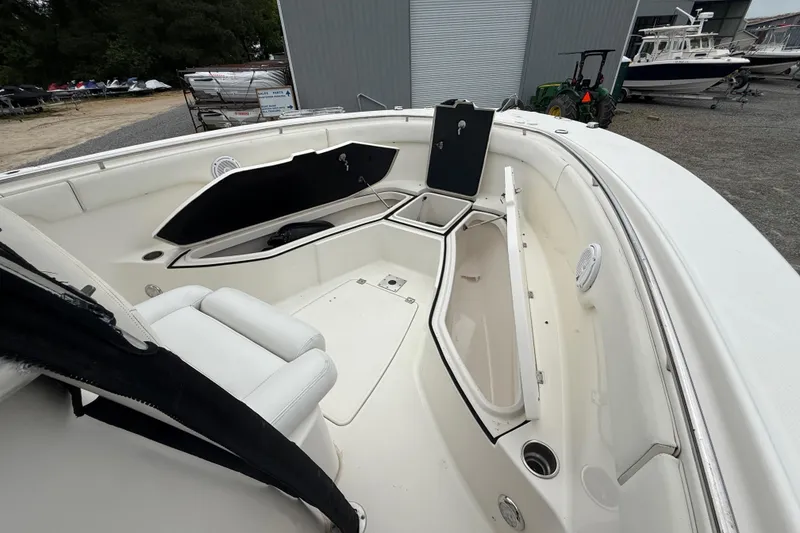 Slide: The Image of 2008 Robalo R300 Center Console boat interior with open storage compartments. - 13