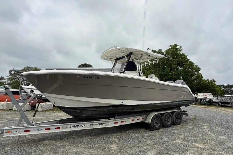 Slide: The Image of 2008 Robalo R300 Center Console boat on trailer, parked outdoors on gravel. - 3