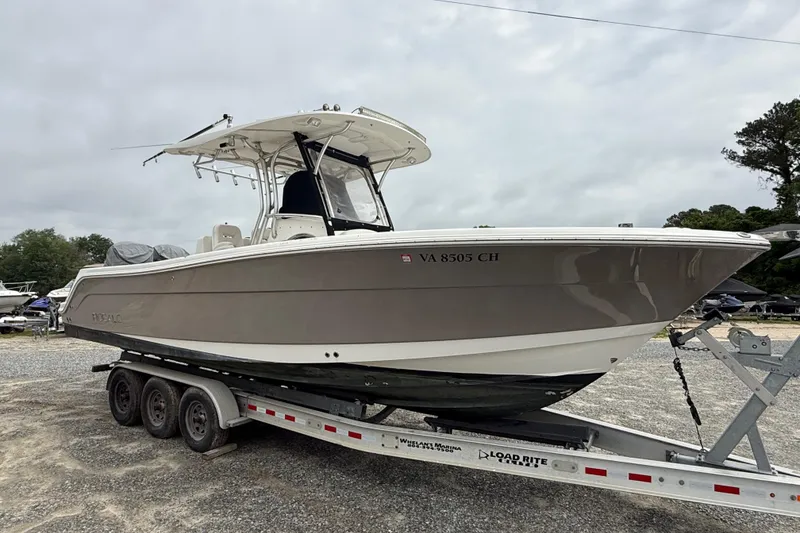 Slide: The Image of 2008 Robalo R300 Center Console boat on trailer, parked outdoors. - 30