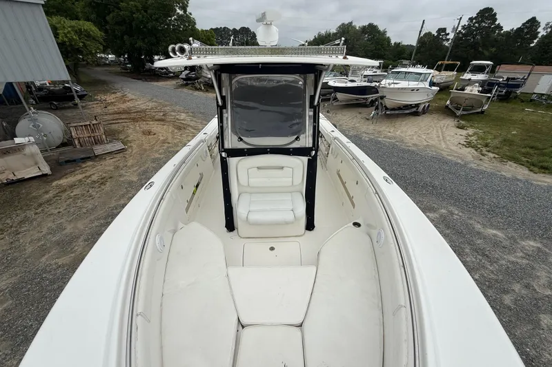 Slide: The Image of 2008 Robalo R300 Center Console boat with spacious seating and sleek design. - 9