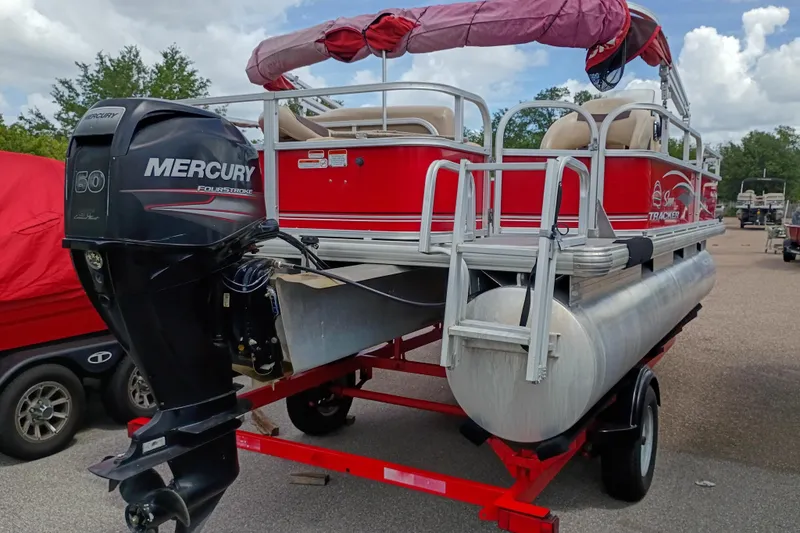 Slide: The Image of 2017 Sun Tracker Bass Buggy 18 DLX pontoon boat with Mercury 60 FourStroke engine. - 2