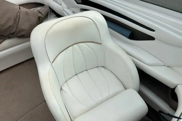Slide: The Image of Interior of a 1998 Sea Ray 210 Bow Rider with white seating. - 12