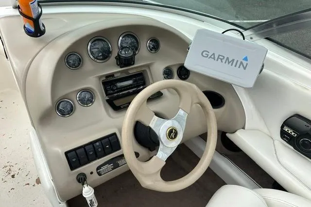Slide: The Image of Dashboard of a 1998 Sea Ray 210 Bow Rider with Garmin navigation system. - 14