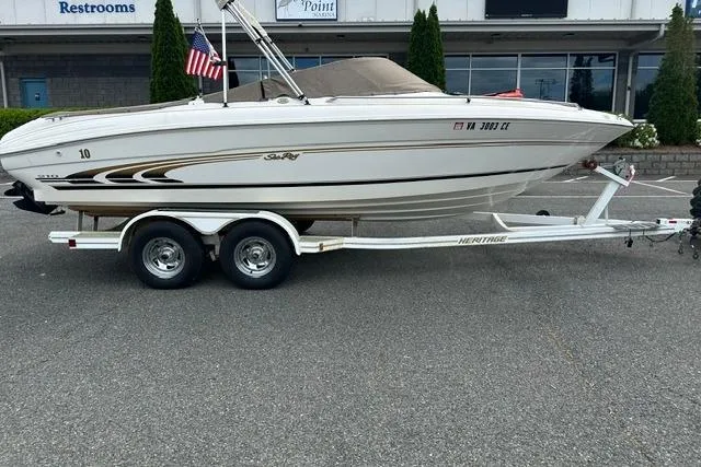 The Image of 1998 Sea Ray 210 Bow Rider on trailer, side view. - 2