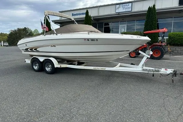 Slide: The Image of 1998 Sea Ray 210 Bow Rider on trailer in front of building. - 3