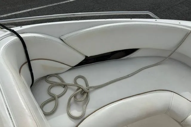 Slide: The Image of Interior of a 1998 Sea Ray 210 Bow Rider boat with rope. - 9