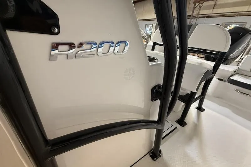 Slide: The Image of 2026 Robalo R200 Center Console boat interior with logo detail. - 11