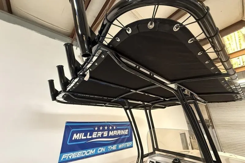 Slide: The Image of 2026 Robalo R200 Center Console boat with T-top at Miller's Marine showroom. - 12
