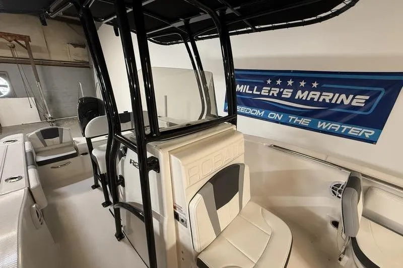 Slide: The Image of 2026 Robalo R200 Center Console boat interior at Miller's Marine showroom. - 13
