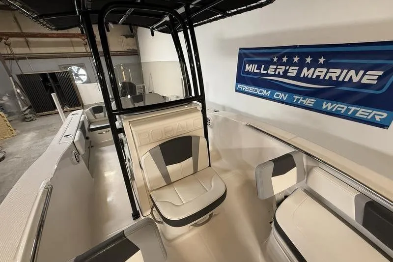 Slide: The Image of 2026 Robalo R200 Center Console boat interior at Miller's Marine showroom. - 14