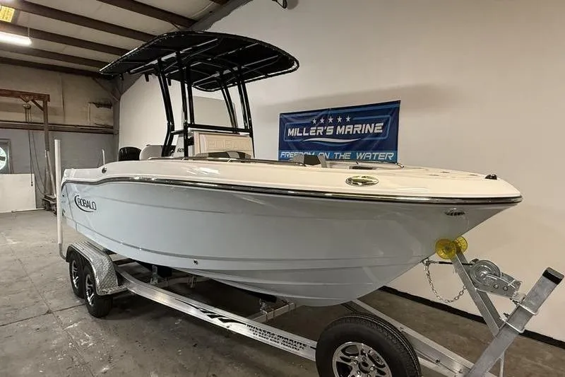 Slide: The Image of 2026 Robalo R200 Center Console boat on trailer at Miller's Marine showroom. - 2