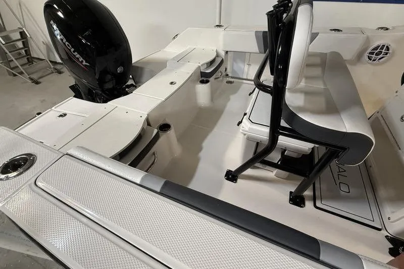 Slide: The Image of 2026 Robalo R200 Center Console boat interior with seating and Mercury engine. - 4