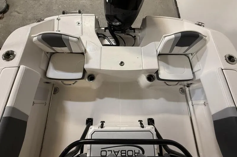 Slide: The Image of 2026 Robalo R200 Center Console boat interior with seating and motor, viewed from above. - 5
