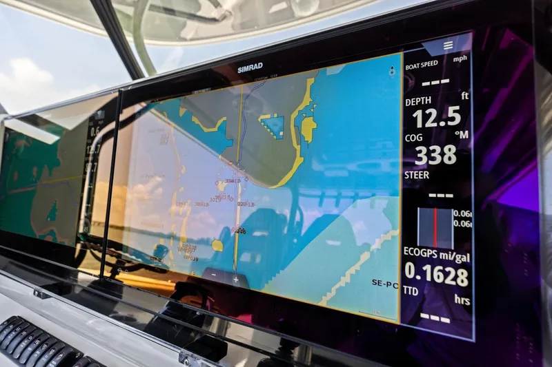 Slide: The Image of Simrad navigation display on Freeman 42LR boat, showing depth and course data. - 12