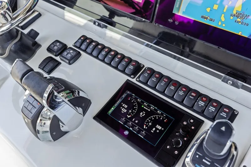 Slide: The Image of Control panel of a 2020 Freeman 42LR boat with navigation and throttle controls. - 14