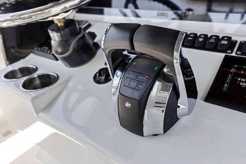 Slide: The Image of Control panel of a 2020 Freeman 42LR boat with throttle and display. - 15