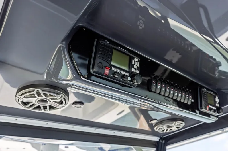 Slide: The Image of Control panel of a 2020 Freeman 42LR boat with speakers and electronic devices. - 17