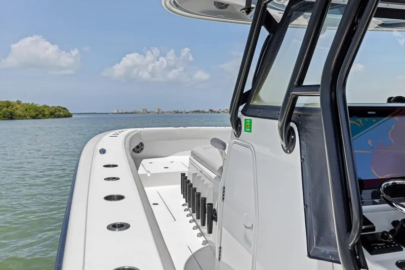 Slide: The Image of Freeman 42LR boat, 2020 model, cruising on calm waters with clear skies. - 20
