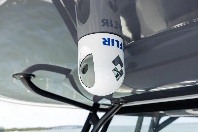 Slide: The Image of FLIR camera mounted on a 2020 Freeman 42LR boat, under a canopy. - 21