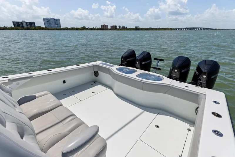 Slide: The Image of Freeman 42LR 2020 boat with Mercury engines on calm water, clear sky. - 24