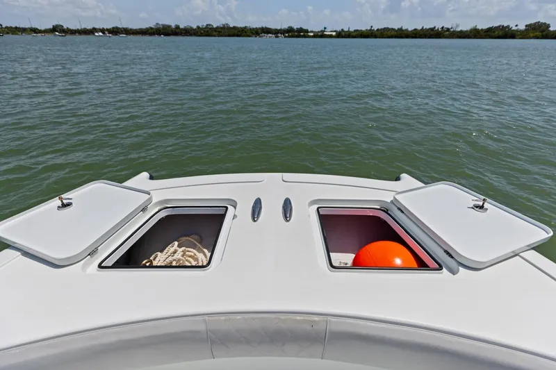 Slide: The Image of Bow storage compartments on a 2020 Freeman 42LR boat, open with rope and buoy. - 41