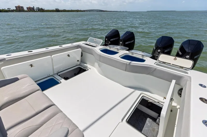 Slide: The Image of 2020 Freeman 42LR boat with Mercury engines, spacious deck, and storage compartments. - 42