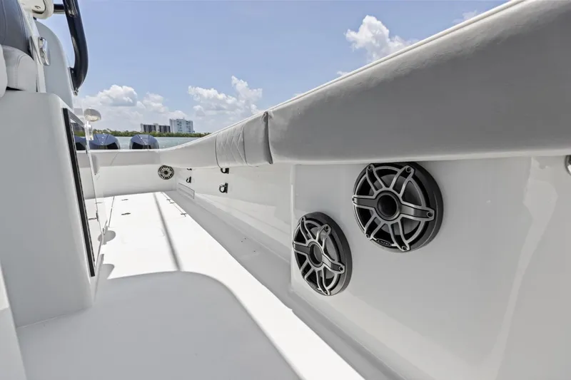 Slide: The Image of 2020 Freeman 42LR boat deck with speakers, under a clear blue sky. - 49