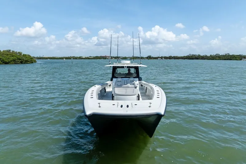 Slide: The Image of Freeman 42LR 2020 boat on calm water under a clear blue sky. - 5